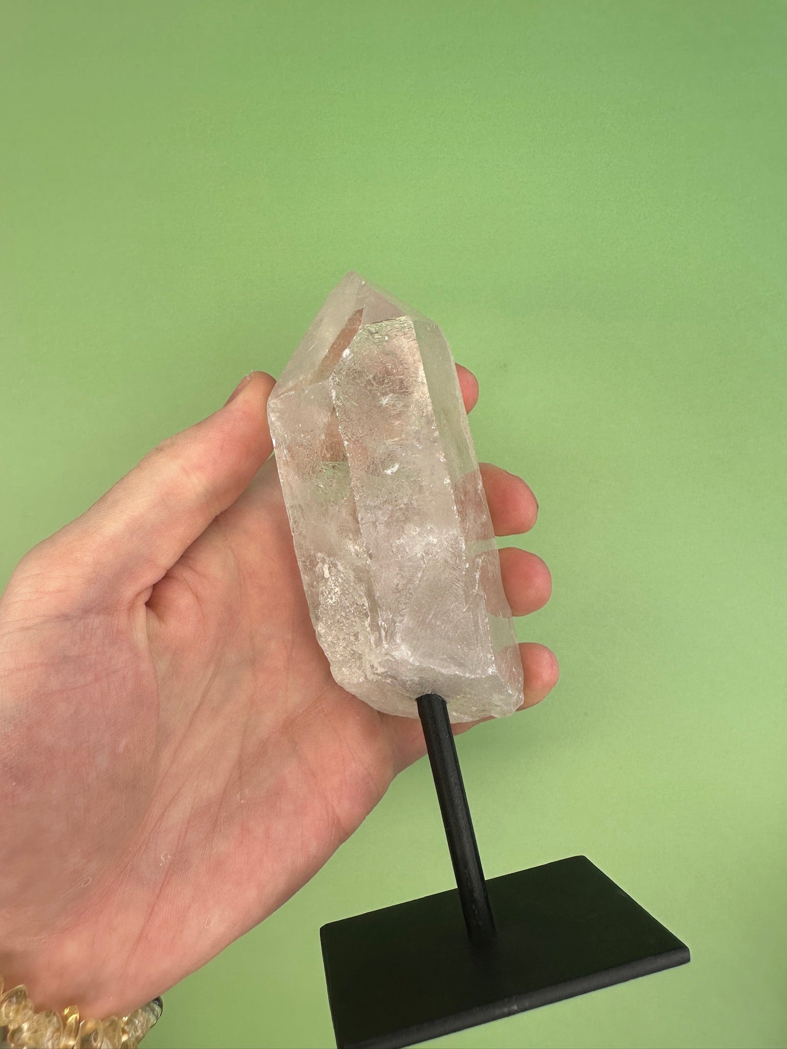 Clear quartz - Rough point on a stand